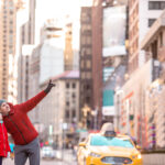 Family of father and little kid on Times Square during their vacation in New York City